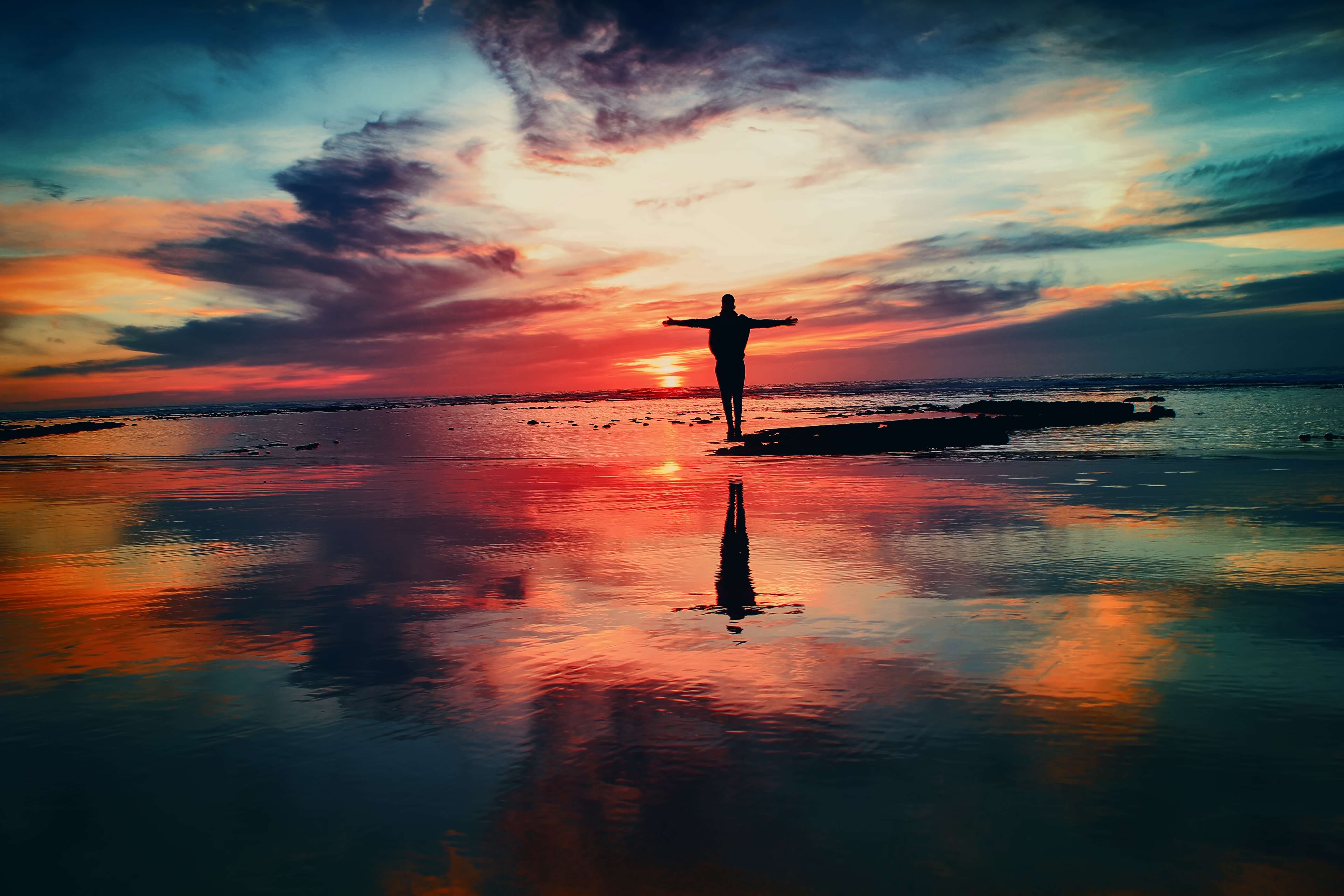 Financial Glass - Man Stand in Front of Ocean Sunset.jpg